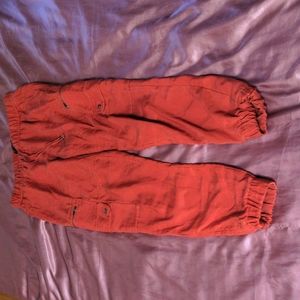 red orange cargo jogger pants with pockets